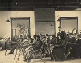 Formal class in liberal arts and sciences Hampton Institute, Hampton, Va. - writing on blackboard reads "clay modeling" 1899