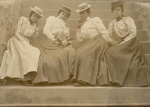 Four African American women seated on steps of building at Atlanta University, Georgia 1899