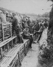 German Soldiers relax in their deep trenches which in the Stalemates of WWI have become a home. 1918