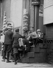 Group of newsboys on a stoop at 4th & Market Sts. Wilmington, DE 1910