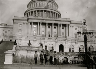 Three Italian Newsboys on the steps of the Capitol Building in Washington, DC 1912