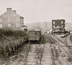Hanover Junction, Pennsylvania. View of railroad station and boxcars 1864