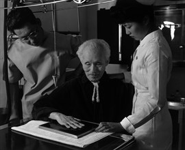 Nurse Aiko Hamaguchi, Harry Sumida and Michael Yonemetsu [i.e., Yonemitsu] in hospital 1943
