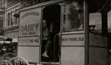 Helper on a dairy wagon. 1916