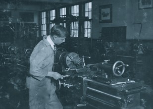 High School boy at work in machine shop. Oklahoma City High School 1917