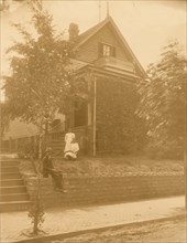 Home of an African American in Atlanta, Georgia, with man and two women in front of house 1899