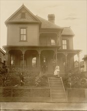 Home of an African American in Atlanta, Georgia, with man, woman & Boy in front of house 1899