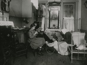 Home-work (crochet) in East Side Tenement home. Grandmother pealing [sic] potatoes. 1912
