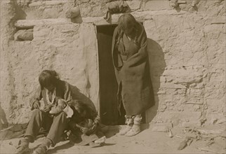 Hopi mending moccasins 1910