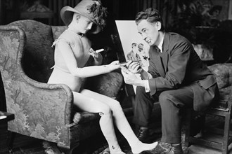 James Montgomery Flagg Poses with a Girl Manikin that he uses from which to paint