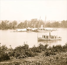 James River, Va. U.S.S. monitor CANONICUS taking on coal from a schooner 1863