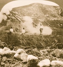Japanese field battery firing shells over the mountains into doomed Port Arthur 1905