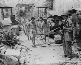 Japanese prisoners of war being guarded by Americans--probably in the Philippines 1944