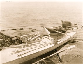 Kayak with seal hunting equipment, Nunivak 1929
