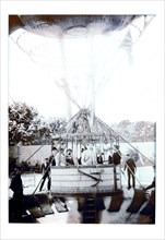 Balloon Expedition; Photographic representation of Men about to lift of in a basket turn of the century