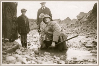 Lindbergh panning gold in a shovel at Pioneer Mine 1908