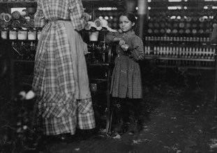 Little Fannie, 7 years old, 48 inches high, helps sister in cotton Mill. 1910