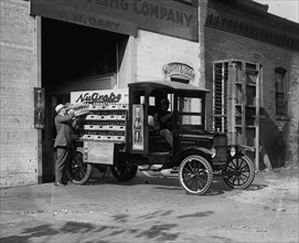 Loading Bottles of Grape Pop on the truck for Delivery 1925