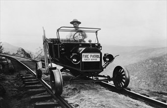 Fire Patrol Rides Steel wheeled car over Railroad Tracks 1915