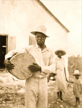 Man posing holding a drum, Cat Island 1935