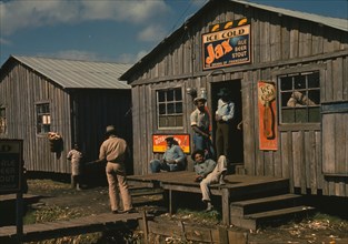 Living quarters and "juke joint" for migratory workers, a slack season; Belle Glade, Fla. 1941