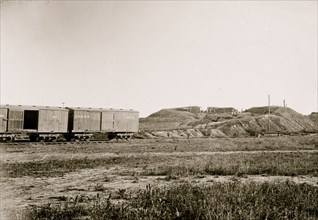 Manassas, Virginia. Confederate fortifications. (U.S. Military Railroad boxcars on left.) Orange & Alexandria Railroad 1862