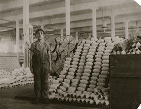 Manuel Miranda, Very young boy, has been doffer in card room of Cornell Mill for 6 months. 1912