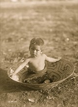 Toddler in Basket 1907