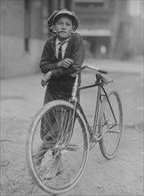 Messenger boy working for Mackay Telegraph Company. Said fifteen years old. Exposed to Red Light dangers. 1913