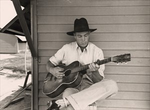 Guitar Playing Migrant Worker 1940