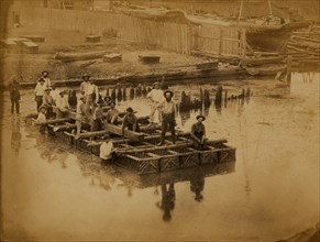 Military construction in northern Virginia: raft of blanket boats ferrying men and timber across the Potomac River
