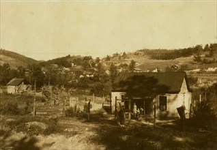 Miners cabins on the Elk River at Bream, W. Va. near Charleston. Others on slope beyond. A typical mining community here. Children go to Big Chimney school. Oct. 10, 1921. Location: Bream, West Virgin...