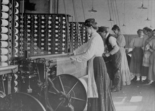 Mollahan Mill, Newberry, S.C. Type of young woman at spinning machine in cotton mills 1908