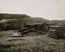 Morris Island, S.C. Two 100-pdr. Parrott guns and stacks of shells inside Fort Putnam 1865