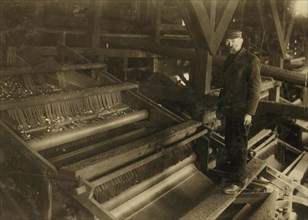 Mr. A. Langerfeld and one of his machines for picking coal which does away completely with the use of breaker boys.  1913