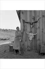 Poverty with Rife and Cattle Skulls 1939