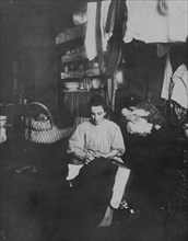 Mrs. Tony Racioppo, 260 Elizabeth St., N.Y. 1st floor rear, finishing pants in dirty tenement home. Although] it is a licensed house, the whole place is very much run down. The hallway [i.e., hallway]...