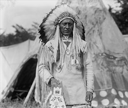 Native American Chief in Traditional Clothing and Feathered Bonnet 1923
