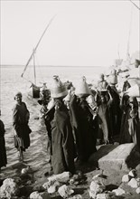 Native women with jars carrying water from the Nile 1910