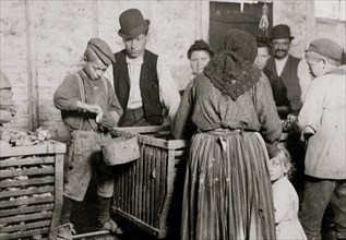 Nine-year-old Johnnie and the shucking-boss.  1911