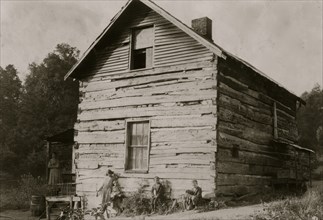 Old Log cabin, the home of Wm. Mullens and family, - near Charleston, W. Va. 1921