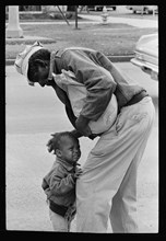 Old man comforting child 1962