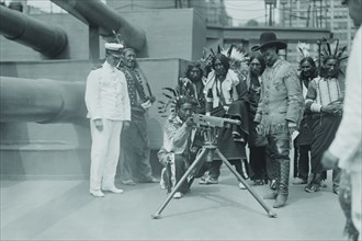 On Board, the "Recruit' a Native American aims a machine gun. 1917