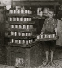 One of the small boys in J. S. Farrand Packing Co. and a heavy load 1911