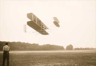 Orville Wright flying in his airplane 1909