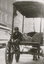 Package help sits on rear of Delivery Wagon 1910