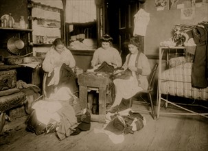Pallagi family finishing pants,  1912