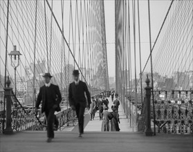 Pedestrians Cross the Brooklyn Bridge 1910