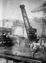 Pedro Miguel locks. Auxiliary crane dumping concrete, Panama Canal 1910