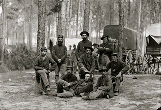 Petersburg, Va. Group of Company B, U.S. Engineer Battalion; wagons in background 1863